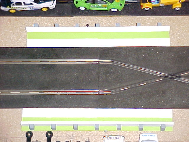 Crossover and straight flanked by track borders